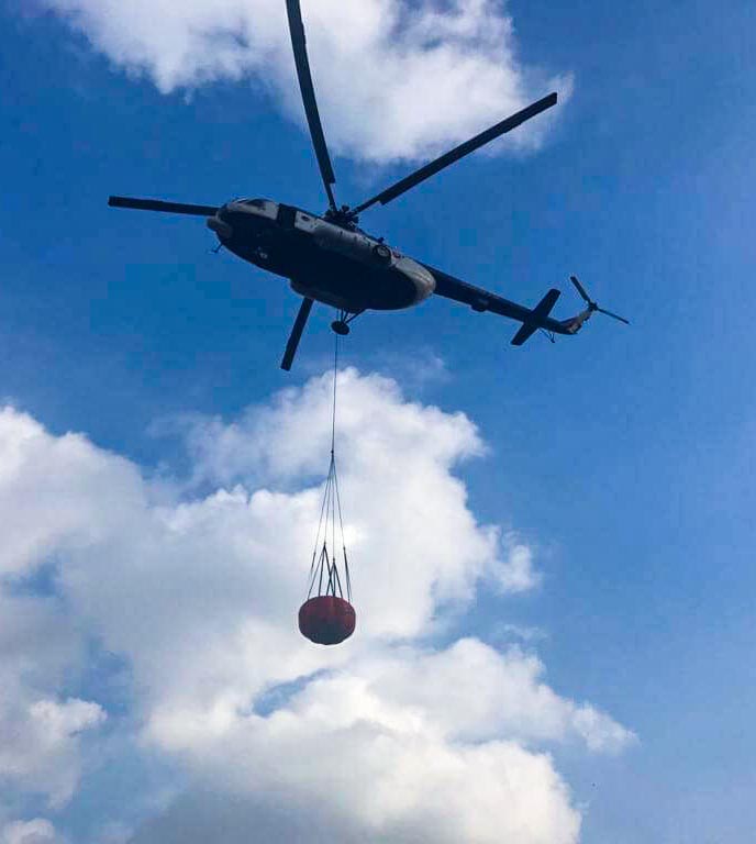 Firefighting helicopter carrying bambi bucket Nixus OTO